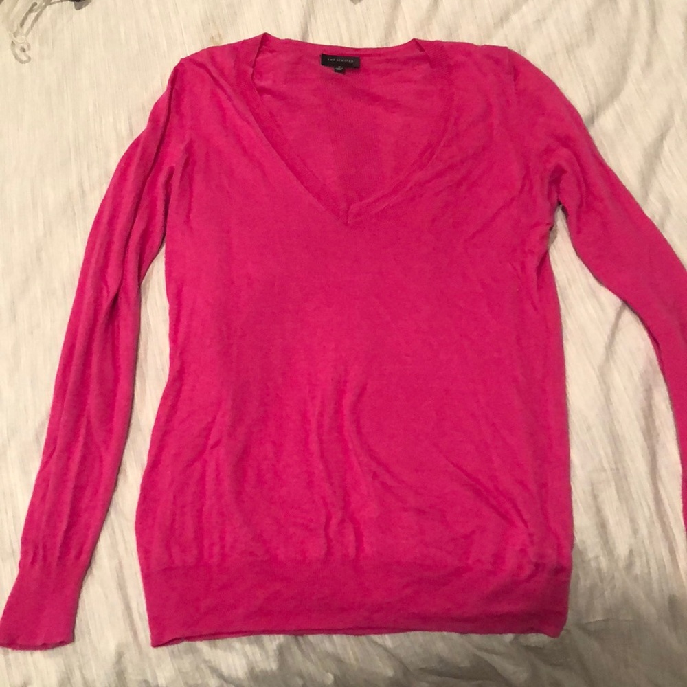 Woman’s pink long sleeve v-neck sweater